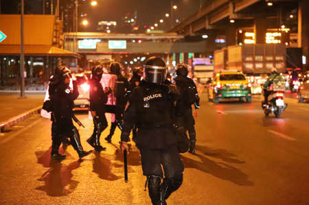 Bangkok, THAILAND - February 28, 2021: Riot police prohibited press take the photo during crack down...