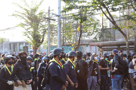 Bangkok, THAILAND - February 20, 2021: Volunteer guard move troop to area for protect the Pro-democracy protest no-confidence motion outside the parliament.のeditorial素材
