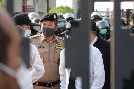 Bangkok, THAILAND - February 20, 2021: Parliamentary Police stand guard to protect Sappaya-Sapasathan from Pro-democracy protesters no-confidence motion outside the parliament.のeditorial素材