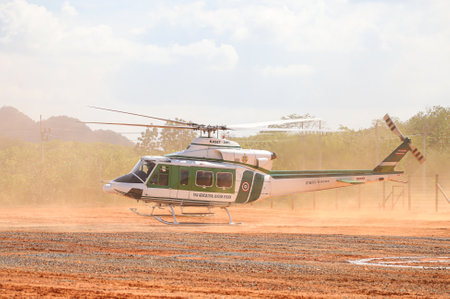 Nakhon Si Thammarat, THAILAND - March 4, 2021: Bell 412EP No. KASET-21111 form Thai Agricultural Aviation Division, Take off during Deputy Minister of Agriculture and Cooperative inspection program.のeditorial素材