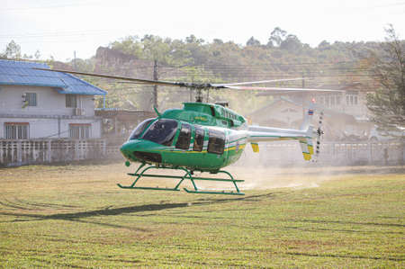 Songkhla, THAILAND - March 5, 2021: Bell 407GXP No. KASET-2322 form Thai Agricultural Aviation Division, Landing between Deputy Minister of Agriculture and Cooperatives inspection program.のeditorial素材