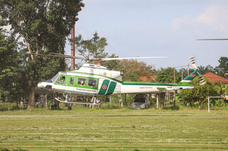 Surat Thani, THAILAND - December 9, 2020: Bell 412EP No. KASET-21111 form Thai Agricultural Aviation Division, Landing between Deputy Minister of Agriculture and Cooperatives inspection program.のeditorial素材