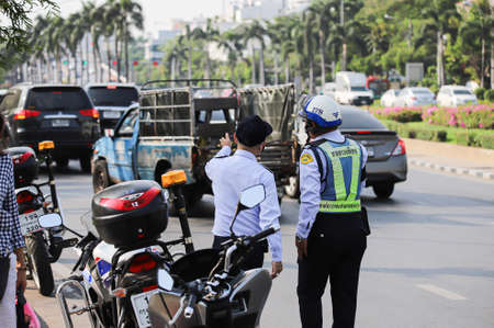 Bangkok, THAILAND - March 20, 2021: à¸ºBMTA Special Patrols facilitate traffic after traffic police close road around protests area.のeditorial素材