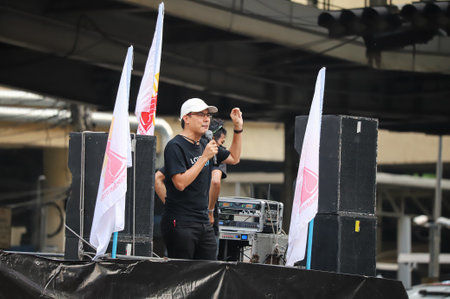 Bangkok, THAILAND - March 24, 2021: Yingcheep Atchanont, manager of iLaw speech to protesters at Ratchaprasong intersection in protests for right to bail protesters leaders and reform of the monarchy.のeditorial素材