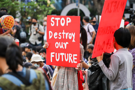 Bangkok, THAILAND - March 24, 2021: Protester show text sign in protests for right to bail protesters leaders and reform of the monarchy at Ratchaprasong intersection.のeditorial素材