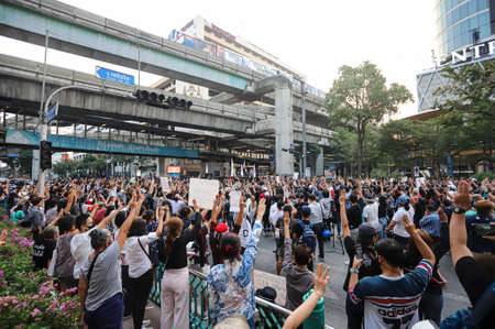 Bangkok, THAILAND - March 24, 2021: Pro-democracy protesters a three finger salute to show symbolic...