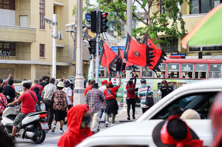 Bangkok, THAILAND - April 10, 2021: UDD Red shirt commemorate the 11th anniversary of the violent crackdown on red-shirt protesters by the government at Kok Wua intersection on Ratchadamnoen Avenue.のeditorial素材