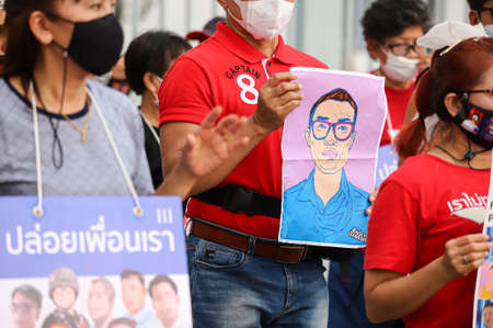 Bangkok, THAILAND - April 10, 2021: Resistant citizen protesters group stand silently 112 minute for...