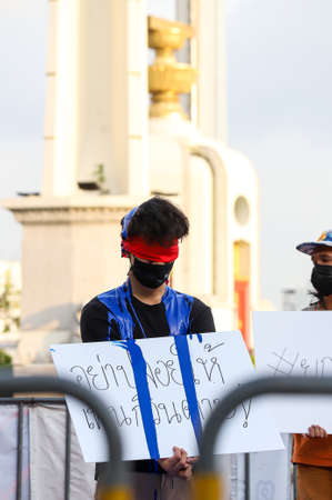 Bangkok, THAILAND - May 2, 2021: Coalition of Salaya for Democracy stand silently 112 minute and...