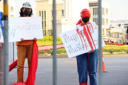 Bangkok, THAILAND - May 2, 2021: Coalition of Salaya for Democracy stand silently 112 minute and performance art at Democracy Monument for protest the Justice and demand release of protest leaders.のeditorial素材