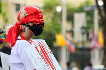 Bangkok, THAILAND - May 2, 2021: Coalition of Salaya for Democracy stand silently 112 minute and performance art at Democracy Monument for protest the Justice and demand release of protest leaders.のeditorial素材