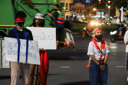 Bangkok, THAILAND - May 2, 2021: Coalition of Salaya for Democracy stand silently 112 minute and performance art at Democracy Monument for protest the Justice and demand release of protest leaders.のeditorial素材