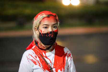 Bangkok, THAILAND - May 2, 2021: Coalition of Salaya for Democracy stand silently 112 minute and performance art at Democracy Monument for protest the Justice and demand release of protest leaders.のeditorial素材