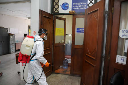 Bangkok, THAILAND - April 30, 2021: Division of Veterinary Inspection and quarantine, spray the disinfectant in the Agricultural Land Reform Office building for protect against covid-19.のeditorial素材