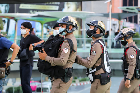 Bangkok, THAILAND - May 10, 2021: Metropolitan police talk to protesters about Communicable Diseases...