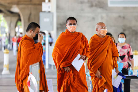 Bangkok, THAILAND - May 17, 2021: The Buddhist monk coming to Nasal Swab Specimen for COVID-19 Testing by BMA Health Department mobile screening unit at Rama VIII Bridge.のeditorial素材