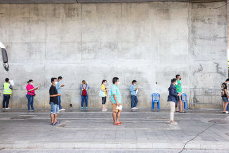 Bangkok, THAILAND - May 17, 2021: The People waiting to Nasal Swab Specimen for COVID-19 Testing by...