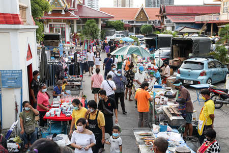 Bangkok, THAILAND - June 7, 2021: People in Bangkok wear face masks shopping at local weekly market as BMA announced shall always wear masks outside Residence or accommodation in COVID-19 situation.のeditorial素材