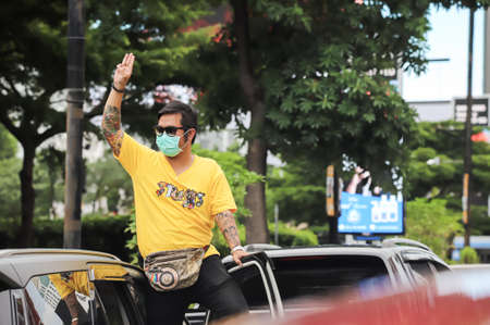 Bangkok, THAILAND - July 10, 2021: Car Mob Protesters a three finger salute to show symbolic...