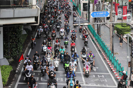 Bangkok, THAILAND - July 10, 2021: Car Mob Protesters driving vehicles and motorcycles with honk to...