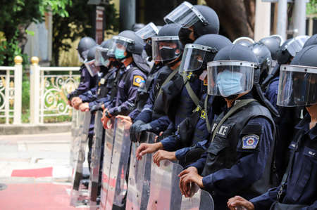 Bangkok, THAILAND - August 7, 2021: Riot police take control area around the Democracy Monument...