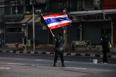 Bangkok, THAILAND - August 7, 2021: Riot police take Din Daeng Junction area, and shoot tear gas, rubber bullets, water cannon for crackdown Pro-democracy protesters.のeditorial素材