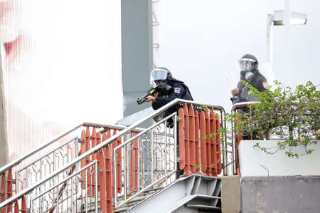 Bangkok, THAILAND - August 7, 2021: Riot police take control Victory Monument to clear area with...