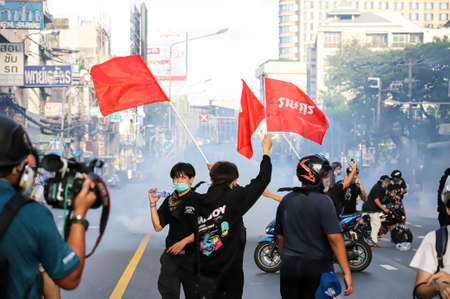 Bangkok, THAILAND - August 7, 2021: Riot police take Din Daeng Junction area, and shoot tear gas, rubber bullets, water cannon for crackdown Pro-democracy protesters.のeditorial素材