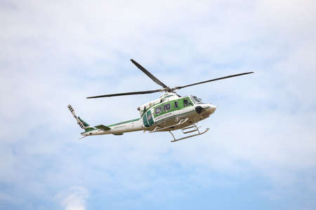 Krabi, THAILAND - April 7, 2021: Bell 412EP No. KASET-21111 form Thai Agricultural Aviation Division, Landing during mission Deputy Minister of Agriculture and Cooperatives inspection program.のeditorial素材