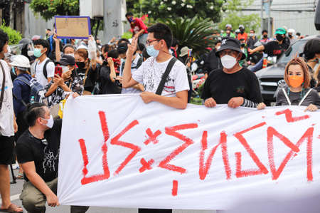 Bangkok, THAILAND - August 13, 2021: Pro-democracy protesters a three finger salute to show symbolic...