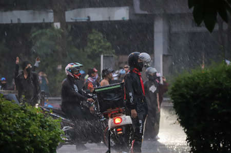 Bangkok, THAILAND - August 13, 2021: Protesters try to pass barrier block to 1st Infantry Regiment...