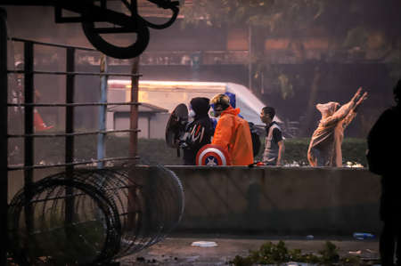 Bangkok, THAILAND - August 13, 2021: Protesters try to pass barrier block to 1st Infantry Regiment for Protest anti-government about agricultural products price drop and failed covid-19 management.のeditorial素材