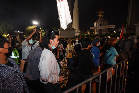 Bangkok, THAILAND - August 18, 2021: Pro-democracy protesters "Thalufah" burning the government straw puppet for Protest government about failed Covid-19 management at Democracy Monument.のeditorial素材