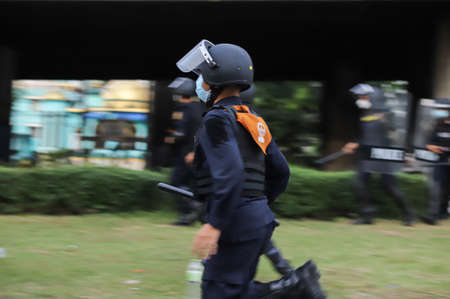 Bangkok, THAILAND - August 22, 2021: Anti-government protesters clashed Riot police at Vibhavadi...