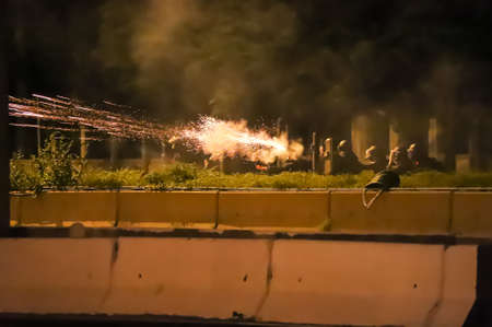 Bangkok, THAILAND - September 12, 2021: Anti-government protesters clashed Riot police at Vibhavadi...