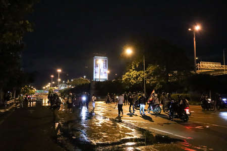 Bangkok, THAILAND - September 12, 2021: Anti-government protesters clashed Riot police at Vibhavadi Rangsit Road near Royal Thai Army Band Department on the way to 1st Infantry Regiment, PM house.のeditorial素材