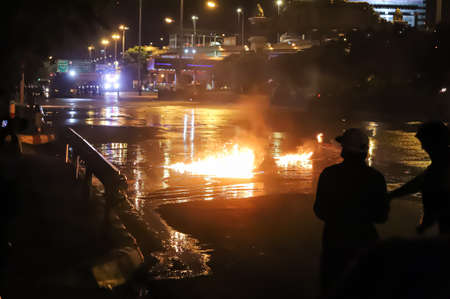 Bangkok, THAILAND - September 12, 2021: Anti-government protesters clashed Riot police at Vibhavadi Rangsit Road near Royal Thai Army Band Department on the way to 1st Infantry Regiment, PM house.のeditorial素材