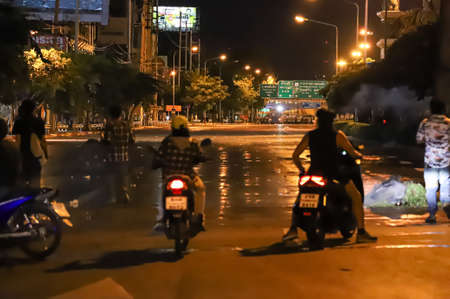 Bangkok, THAILAND - September 12, 2021: Anti-government protesters clashed Riot police at Vibhavadi Rangsit Road near Royal Thai Army Band Department on the way to 1st Infantry Regiment, PM house.のeditorial素材