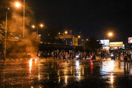 Bangkok, THAILAND - September 12, 2021: Anti-government protesters clashed Riot police at Vibhavadi Rangsit Road near Royal Thai Army Band Department on the way to 1st Infantry Regiment, PM house.のeditorial素材