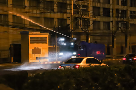 Bangkok, THAILAND - September 12, 2021: Riot police used High-pressure water cannon to extinguish...