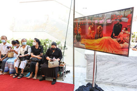 Bangkok, THAILAND - December 12, 2021: Monks and people farewell the passing of the Revered monk...
