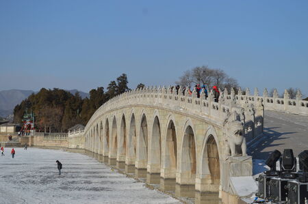 Tourist walking across a bridge in Beijing, Chinaのeditorial素材