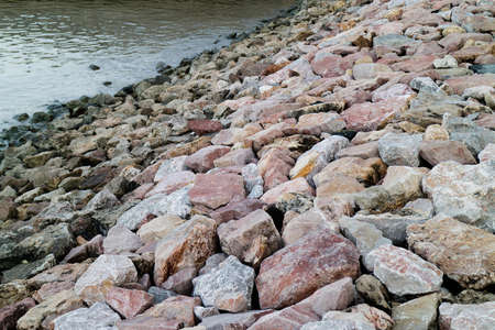 Rocks on the coast near the river.の写真素材