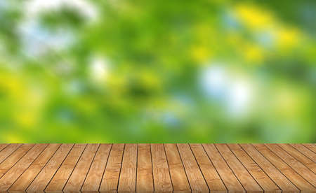 Wood table top on blurred green background - can be used for montage or display your productsの写真素材