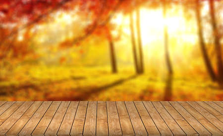 Wood table top on blurred red background - can be used for montage or display your products