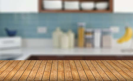 Wood table top on blur kitchen background - can be used for display or montage your productsの写真素材