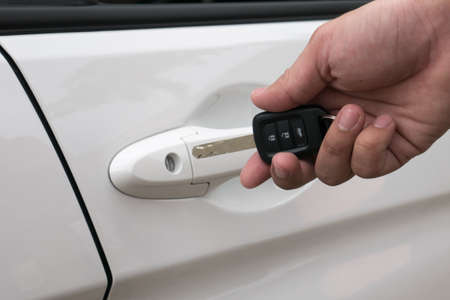 Hand pressing remote control car key