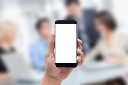 hands holding the phone black blur business