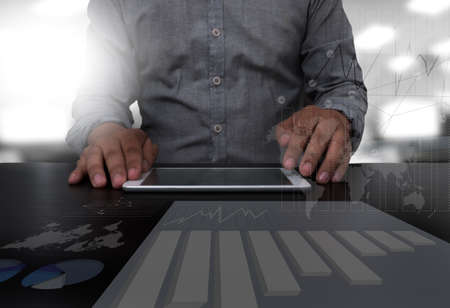 businessman hand working with modern technology digital tablet computer and digital layer effect as...