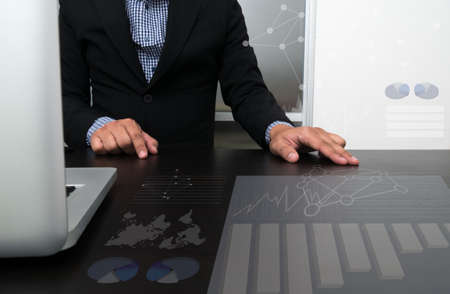 businessman hand working with modern technology and digital layer effect as business strategy conceptの写真素材